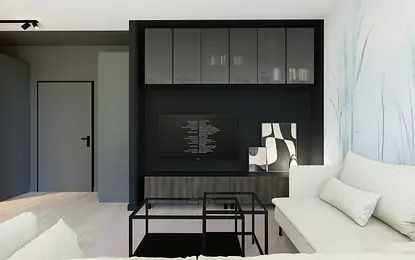 Współczesny salon z czarną ścianą, jasną sofą i minimalistycznym wystrojem.