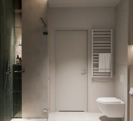 Wnętrze nowoczesnej łazienki z zieloną płytką, minimalistycznymi detalami i soft minimalizmem.