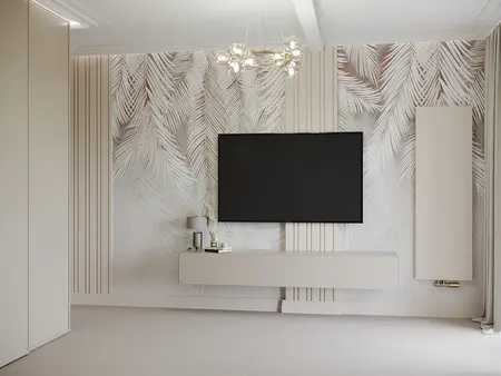 Minimalistyczne wnętrze z telewizorem na ścianie i jasnymi meblami.