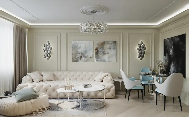 Nowoczesny salon w stylu glamour z jasnymi meblami i dekoracjami.