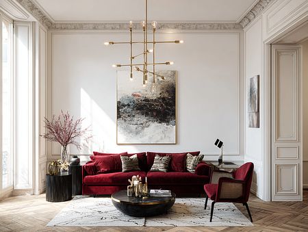 Wnętrze salonu w stylu quiet luxury z czerwonymi meblami i drewnianą podłogą.