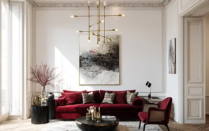 Wnętrze salonu w stylu quiet luxury z czerwonymi meblami i drewnianą podłogą.