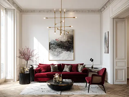 Wnętrze salonu w stylu quiet luxury z czerwonymi meblami i drewnianą podłogą.