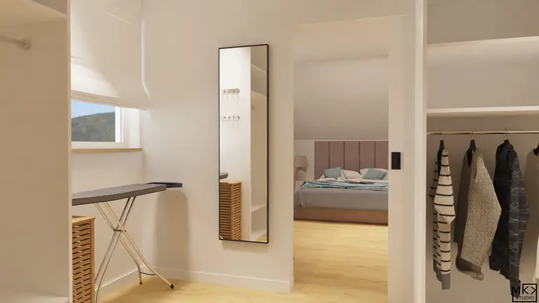 Garderoba z lustrzanym odbiciem, drewnianą podłogą i szafą na ubrania w stylu współczesnym.