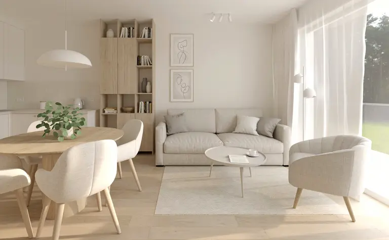 Salon w stylu soft minimalizm z jasnymi meblami i drewnianymi akcentami.