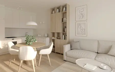 Wnętrze kuchni w stylu soft minimalizm z białymi meblami i drewnianym stołem.