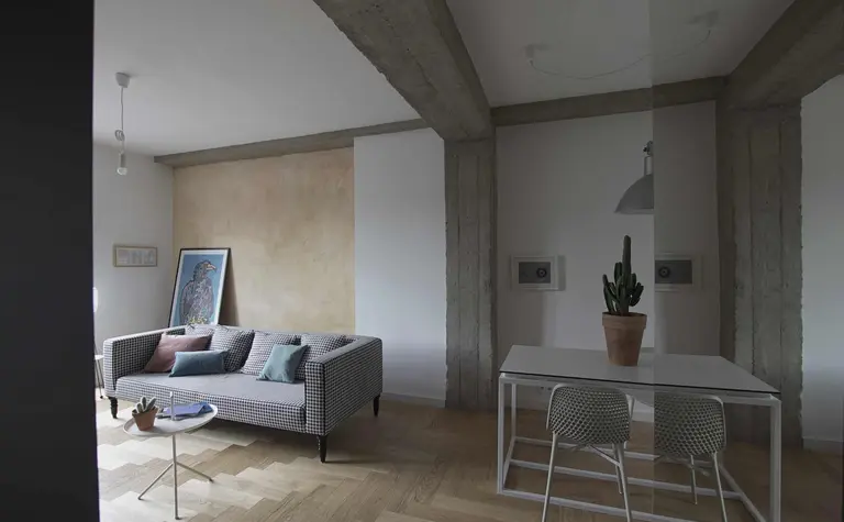 Eklektyczne wnętrze salonu z minimalistycznym stołem i nowoczesną sofą.