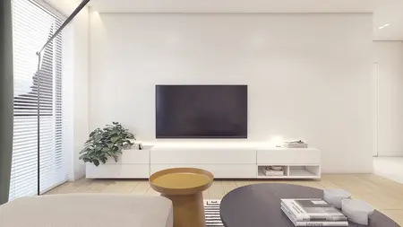 Wnętrze nowoczesnego salonu z białymi ścianami i drewnianą podłogą, skandynawski styl.