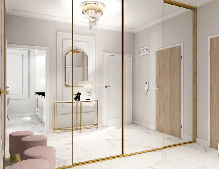 Przedpokój w stylu glamour z dużym lustrem i eleganckimi detalami.