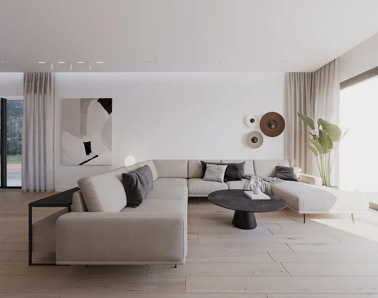 Wnętrze salonu w stylu minimalistycznym z jasnymi meblami i rośliną.