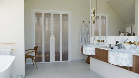 Wnętrze łazienki w stylu art deco z marmurowymi wykończeniami i złotymi detalami.