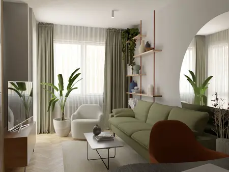 Wnętrze salonu w stylu soft minimalizm z zieloną sofą, roślinami i drewnianymi akcentami.