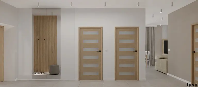 Przedpokój w stylu japandi z minimalistycznymi elementami i nowoczesnymi drzwiami.