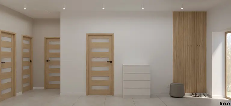 Przedpokój w stylu japandi, minimalistyczny z białą komodą i drewnianymi akcentami.