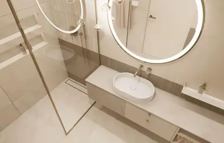 Nowoczesna łazienka z minimalistycznym wystrojem, okrągłymi lustrami i elegancką umywalką.