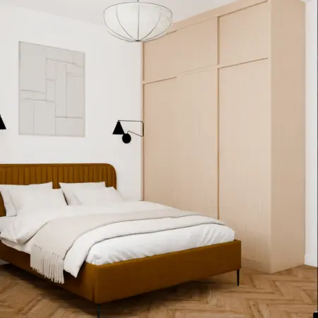 Sypialnia z brązowym łóżkiem, białymi poduszkami i drewnianą podłogą w stylu vintage.