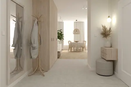 Przedpokój w stylu boho i soft minimalizm z drewnianymi akcentami i roślinami.
