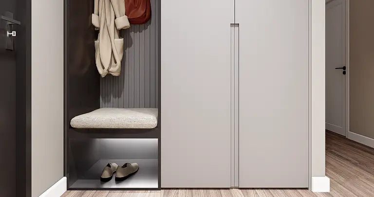 Przedpokój z minimalistycznym designem, w stylu minimaluxe, z szarymi meblami i drewnianą podłogą.