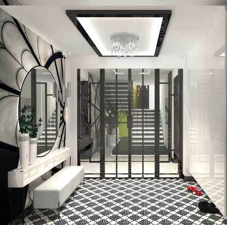 Przedpokój w stylu art deco i glamour z czarną podłogą i dużym lustrem.