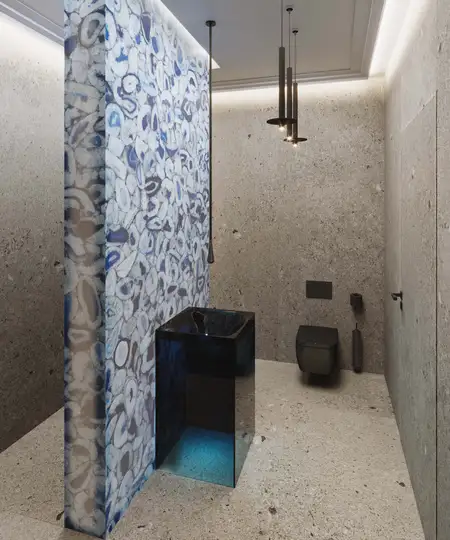 Nowoczesna łazienka z granitowymi ścianami i designerską umywalką.