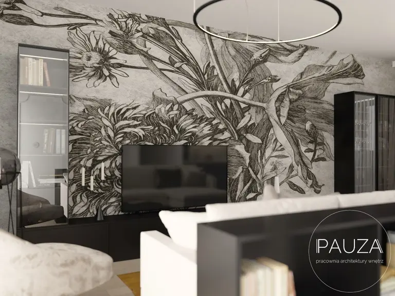 Nowoczesny salon z telewizorem i muralem roślinnym na ścianie.