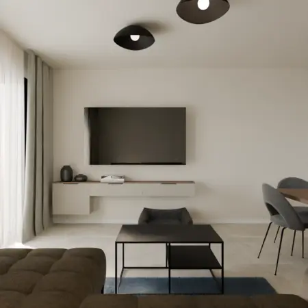 Współczesny salon z telewizorem, minimalistycznymi meblami i szarymi akcentami.