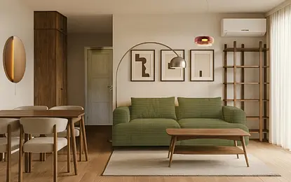 Wnętrze salonu w stylu boho z zieloną sofą, drewnianym stołem i nowoczesnym oświetleniem.