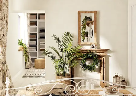 Wnętrze w stylu boho z roślinami, drewnianymi detalami i rustykalnym kominkiem