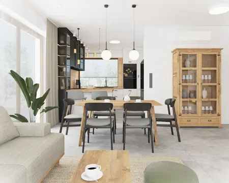 Wnętrze kuchni z drewnianym stołem, szarymi krzesłami oraz roślinami. Styl boho i eklektyczny.