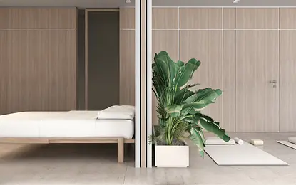 Wnętrze sypialni w stylu japandi i minimalistycznym z roślinami.