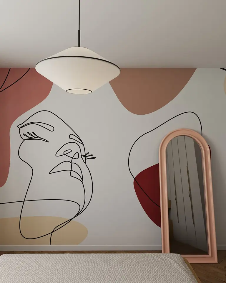 Eklektyczne wnętrze z nowoczesnym oświetleniem i współczesną grafiką na ścianie.