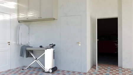 Wnętrze pomieszczenia do prasowania z szarymi ścianami i vintage akcentami.