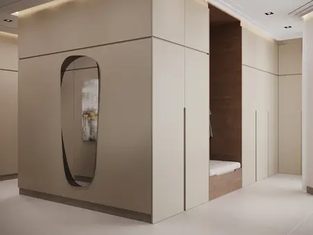 Przedpokój z minimalistycznym designem, beżowe ściany i nowoczesne lustro.