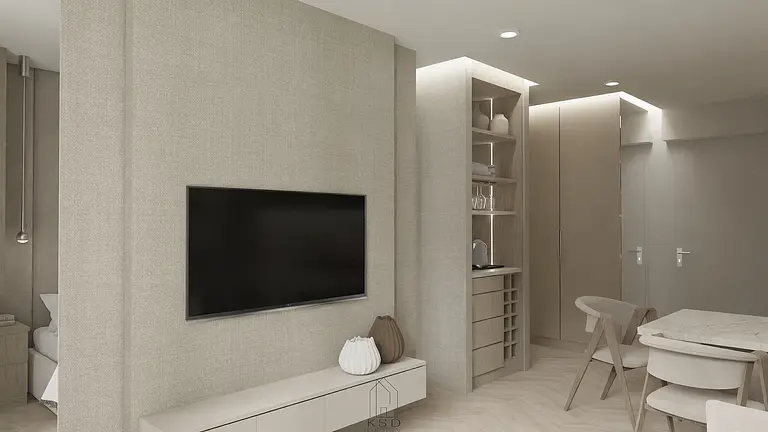 Wnętrze w stylu soft minimalizm z telewizorem, jasnymi meblami i drewnianymi detalami.