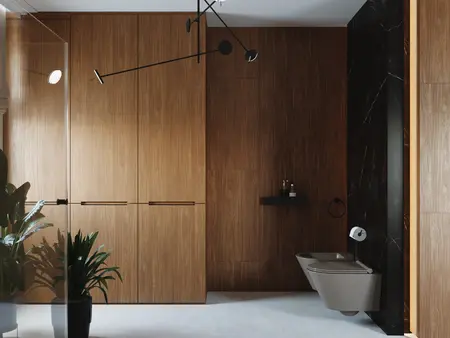 Wnętrze łazienki z minimalistycznym designem, drewniane wykończenia i roślinność.