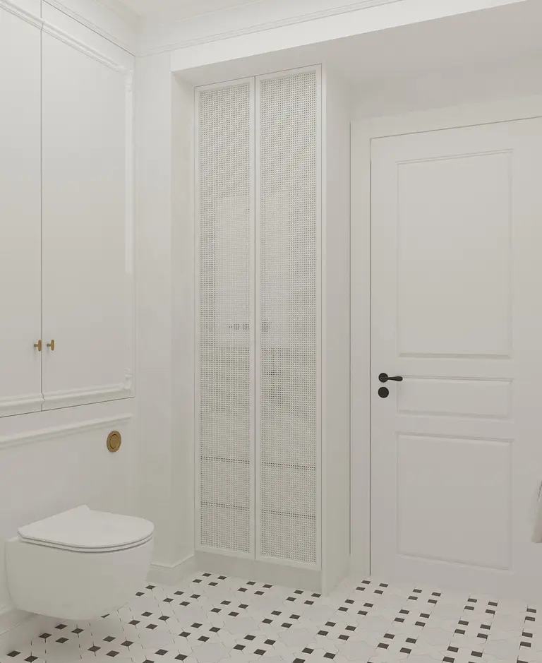Wnętrze łazienki z białymi meblami, podłogą art deco oraz tradycyjnymi detalami.