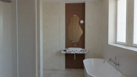 Wnętrze łazienki w stylu minimalistycznym z marmurową umywalką i wanną.