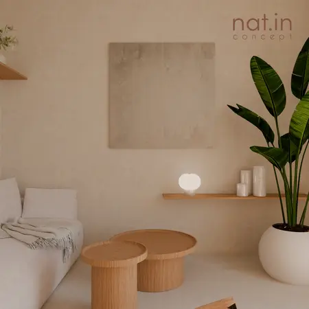 Wnętrze w stylu japandi z jasnymi meblami i roślinami.