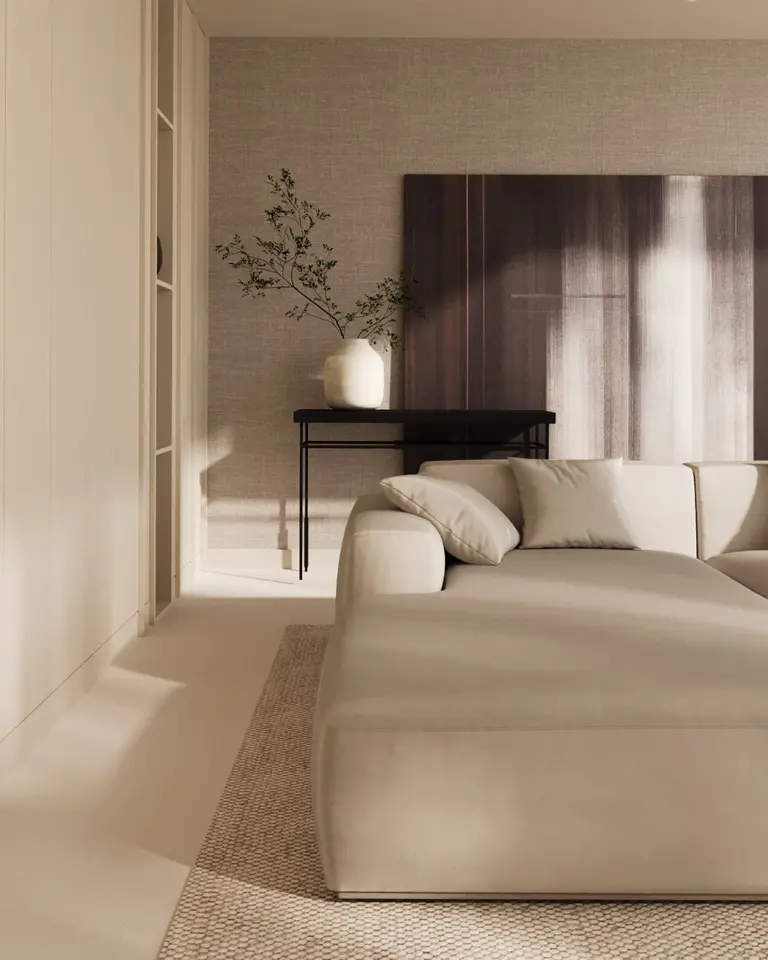 Salon w stylu minimalistycznym z beżową sofą i akcentem w postaci drewnianego obrazu.