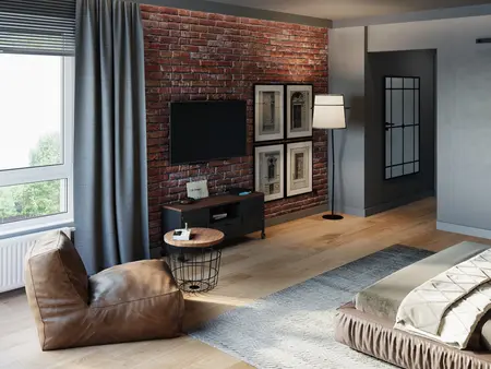 Wnętrze salonu w stylu industrialnym i soft minimalizm z ceglaną ścianą i nowoczesnym oświetleniem.