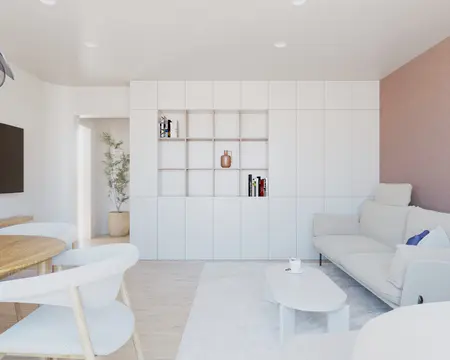 Salon w stylu skandynawskim z białą sofą i drewnianym stołem.