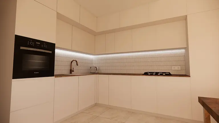 Kuchnia minimalistyczna z białymi meblami i nowoczesnym sprzętem.