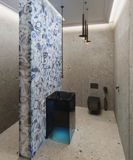 Nowoczesna łazienka z granitowymi ścianami i designerską umywalką.