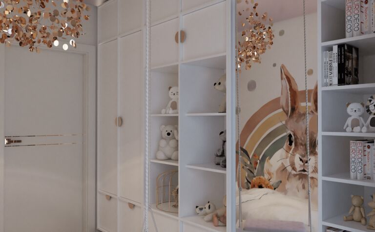 Pokój dziecięcy z białymi meblami, złotymi akcentami i dekoracjami w stylu glamour i nowoczesnym.