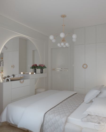 Sypialnia w stylu glamour i nowoczesnym z białymi meblami i złotymi detalami.