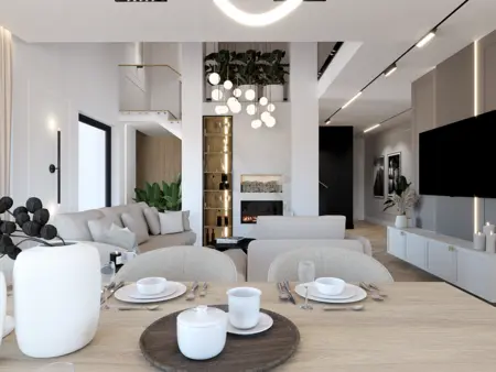 Wnętrze w stylu art deco z roślinami, jasnymi meblami i nowoczesnym oświetleniem.