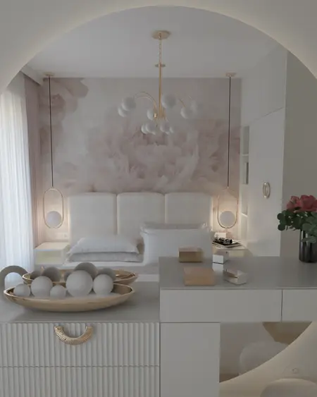 Sypialnia z białym łóżkiem, złotymi lampami i dekoracjami w stylu glamour i nowoczesnym.