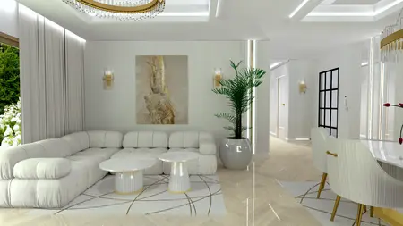 Wnętrze salonu z białą sofą, złotymi detalami i rośliną.