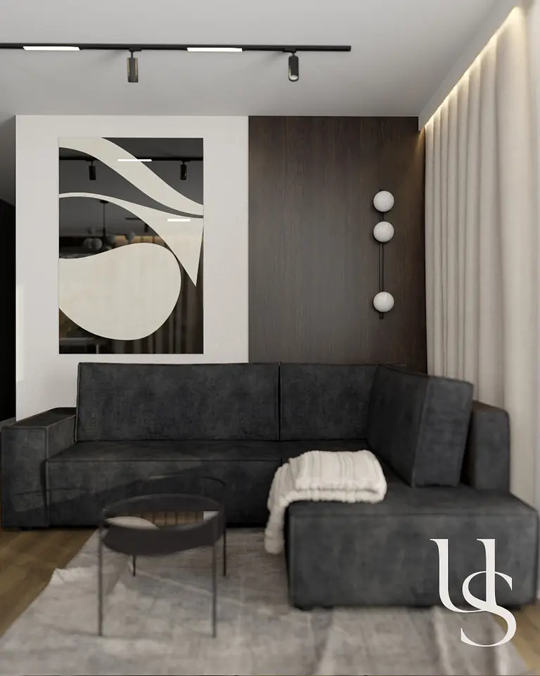 Wnętrze salonu w stylu quiet luxury i współczesnym z ciemną sofą i drewnianymi akcentami.