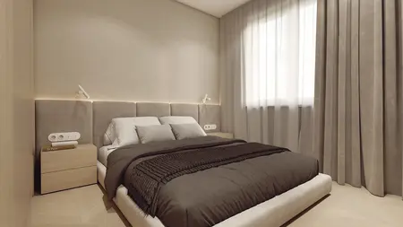 Wnętrze sypialni w stylu japandi, minimalistycznym z beżowym łóżkiem i drewnianymi detalami.